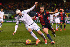 GENOA, ITALY - FEBRUARY 06: Diego Suarez (R) of Genoa CFC tackles Sergej Milinkovic of SS Lazio during the Serie A match between Genoa CFC and SS Lazio at Stadio Luigi Ferraris on February 6, 2016 in Genoa, Italy. (Photo by Valerio Pennicino/Getty Images)